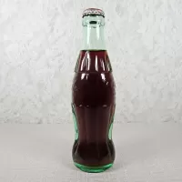 New Orleans Louisiana vintage 8 oz full hobbleskirt no refill Coke bottle with Coca Cola Classic cap: Left - Click to enlarge