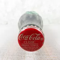 New Orleans Louisiana vintage 8 oz full hobbleskirt no refill Coke bottle with Coca Cola Classic cap: Top - Click to enlarge