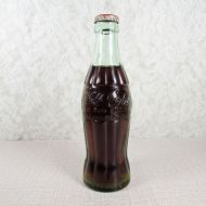 Kearney Nebraska vintage 6 oz full hobbleskirt Coke bottle with red Coca Cola Classic cap: Front
