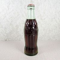 Kearney Nebraska vintage 6 oz full hobbleskirt Coke bottle with red Coca Cola Classic cap: Front - Click to enlarge