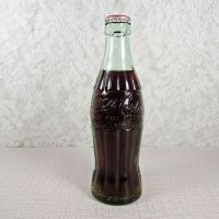 Kearney Nebraska vintage 6 oz full hobbleskirt Coke bottle with red Coca Cola Classic cap: Back - Click to enlarge
