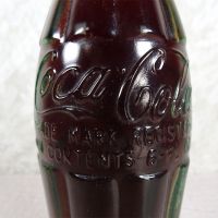 Kearney Nebraska vintage 6 oz full hobbleskirt Coke bottle with red Coca Cola Classic cap: Contents - Click to enlarge