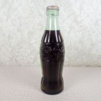 Scottsbluff Nebraska vintage 6 oz full hobbleskirt Coke bottle with red Coca Cola Classic cap: Front - Click to enlarge