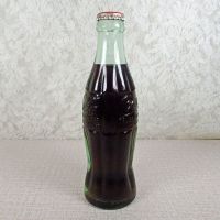 Scottsbluff Nebraska vintage 6 oz full hobbleskirt Coke bottle with red Coca Cola Classic cap: Left - Click to enlarge