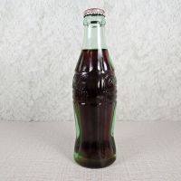 Las Vegas Nevada vintage 6 oz full hobbleskirt Coke bottle with red Coca Cola Classic cap: Left - Click to enlarge