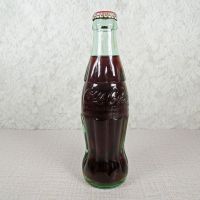 Las Vegas Nevada vintage 8 oz full hobbleskirt Coke bottle with red Coca Cola Classic cap: Front - Click to enlarge