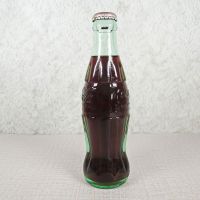 Las Vegas Nevada vintage 8 oz full hobbleskirt Coke bottle with red Coca Cola Classic cap: Left - Click to enlarge