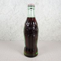 Deming New Mexico vintage 6 oz full hobbleskirt Coke bottle with red Coca Cola Classic cap: Front - Click to enlarge