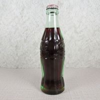 Deming New Mexico vintage 6 oz full hobbleskirt Coke bottle with red Coca Cola Classic cap: Left - Click to enlarge