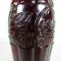 Deming New Mexico vintage 6 oz full hobbleskirt Coke bottle with red Coca Cola Classic cap: Contents - Click to enlarge