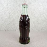 Charlotte North Carolina vintage 6 oz full hobbleskirt Coke bottle with red Coca Cola Classic cap: Left - Click to enlarge