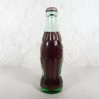 Austin Texas vintage 8 oz full hobbleskirt no refill Coke bottle with Coca Cola Classic cap: Left - Click to enlarge