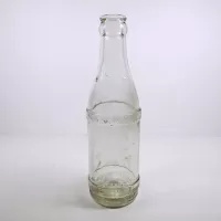 Vintage 1947 Embossed Property of Coca Cola Bot. Co Tiffin O. thick clear glass bottle. Four stars on neck: Front - Click to enlarge