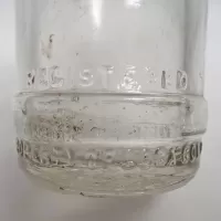 Vintage 1947 Embossed Property of Coca Cola Bot. Co Tiffin O. thick clear glass bottle. Four stars on neck: Coca Cola - Click to enlarge