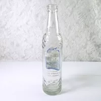 1967 Sun Crest Long Neck 10 oz Vintage ACL Soda Bottle. Blue white graphics. Raised ovals. #5a: Back - Click to enlarge