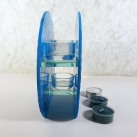 Round top tealight candle holder with blue frosty glass and darker velvet accents. Three candles included: Side View - Click to enlarge