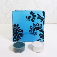 Square two sided blue frosty glass tealight candle holder with darker blue velvet accents. 2 candles included: Front View - Click to enlarge
