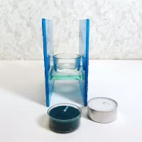 Square two sided blue frosty glass tealight candle holder with darker blue velvet accents. 2 candles included: Left Side View - Click to enlarge
