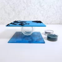 Square two sided blue frosty glass tealight candle holder with darker blue velvet accents. 2 candles included: Top View - Click to enlarge