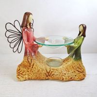 Candle warmer featuring an Angel and child emerging from the earth: Front View - Click to enlarge