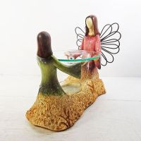 Candle warmer featuring an Angel and child emerging from the earth: Front of Angel View - Click to enlarge