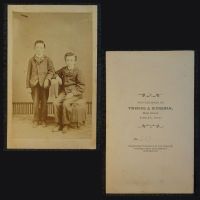 Antique CDV Carte De Visite of two boys and a sideways chair by Twining & Kinneman Findlay Ohio: Front and Back View - Click to enlarge