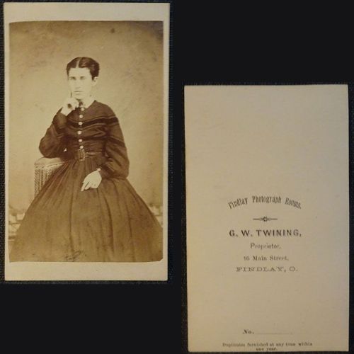 Antique CDV Carte De Visite: Woman from the ankle area up, finger to her cheek wearing a dark, flowing dress: Front and Back View