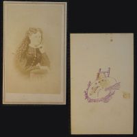 Antique CDV Carte De Visite: Woman from the waist area up with long curly hair, head resting on one hand: Front and Back View - Click to enlarge