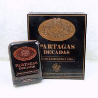 Partagas Decadas 1998 cigar box with three cigar tin carry case. Gold graphics on black. Both empty: Main View - Click to enlarge
