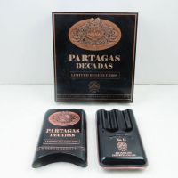 Partagas Decadas 1998 cigar box with three cigar tin carry case. Gold graphics on black. Both empty: Top of All View - Click to enlarge