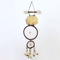 Dream Catcher with image of a buffalo imprinted on a rock hanging from a stick and webbed hoops. Feathers and beads: Back View - Click to enlarge