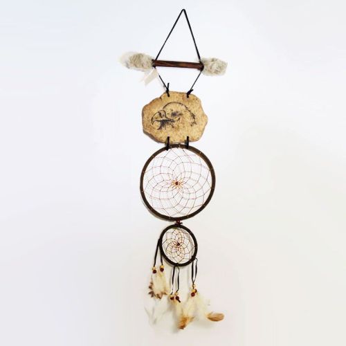 Dream Catcher with image of an eagle head imprinted on a rock hanging from a stick and webbed hoops. Feathers and beads: Front View