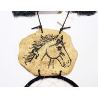 Dream Catcher with image of a horse head imprinted on a rock hanging from a stick and two webbed hoops. Feathers and beads: Closeup View - Click to enlarge