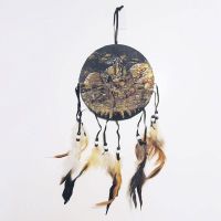 Dream Catcher a sitting Indian warrior holding a rifle, becoming one with nature. Dreamcatcher Wall Hanging: Front View - Click to enlarge