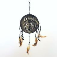 Dream Catcher wolf head on a fabric print with feathers and beads hanging from strips. Dreamcatcher Wall Hanging: Front View