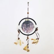 Dream Catcher with round canvas print of a pack of timber wolves on the prowl. Dreamcatcher Wall Hanging: Front View