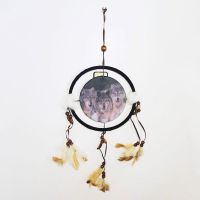 Dream Catcher with round canvas print of a pack of timber wolves on the prowl. Dreamcatcher Wall Hanging: Front View - Click to enlarge