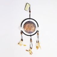 Dream Catcher with round canvas print of a pack of white artic wolves in the snow. Dreamcatcher Wall Hanging: Front View