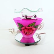 Electric scented oil tart warmer featuring a raised etched rose design against a deep pink background: Back View