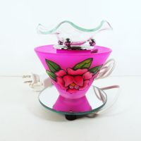 Electric scented oil tart warmer featuring a raised etched rose design against a deep pink background: Back View - Click to enlarge