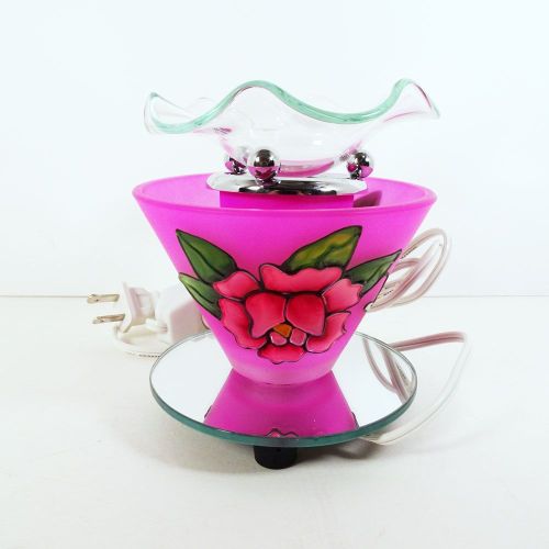 Electric scented oil tart warmer featuring a raised etched rose design against a deep pink background: Back View