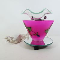 Electric scented oil tart warmer featuring a raised etched rose design against a deep pink background: Left Side View - Click to enlarge
