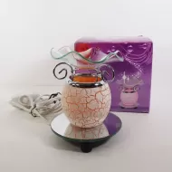 Electric scented oil tart warmer with white crackle design on orange background. Round mirror base: In Box View