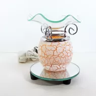 Electric scented oil tart warmer with white crackle design on orange background. Round mirror base: Front