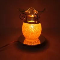 Electric scented oil tart warmer with white crackle design on orange background. Round mirror base: Side View On - Click to enlarge