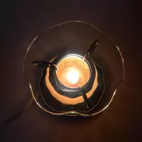 Electric scented oil tart warmer with white crackle design on orange background. Round mirror base: Top On View - Click to enlarge
