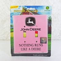 John Deere double light switch plate cover with iconic John Deere logo on a pink background: Front View - Click to enlarge