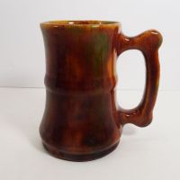 Vintage Brown Glazed Stoneware Mug with Finger Stop Handle and Subtle Color Changes: Left View - Click to enlarge