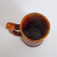 Vintage Brown Glazed Stoneware Mug with Finger Stop Handle and Subtle Color Changes: Top View - Click to enlarge