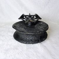 Vintage wood pulley with 5-1/2 inch wood wheel and metal cast iron case or frame with swivel eye. All painted black: Bottom View - Click to enlarge